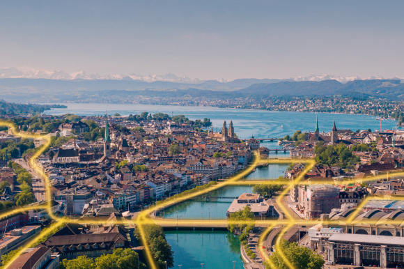 Bild einer Stadt, bei welchem durch eingezeichneten Linien ein Fernwärmenetz gezeigt wird.